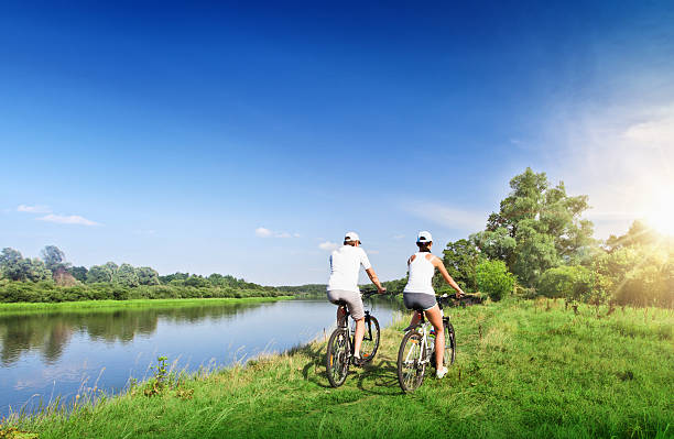 istock Young couple riding bicycles outdoors 485167151