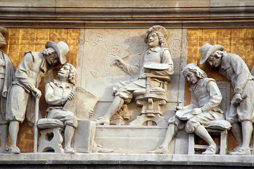 A relief sculpture on the exterior of the Rijksmuseum in Amsterdam.