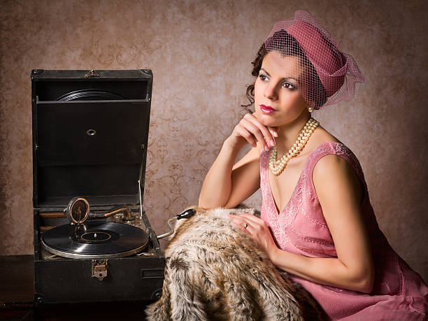 istock Vintage woman and record player 485168229