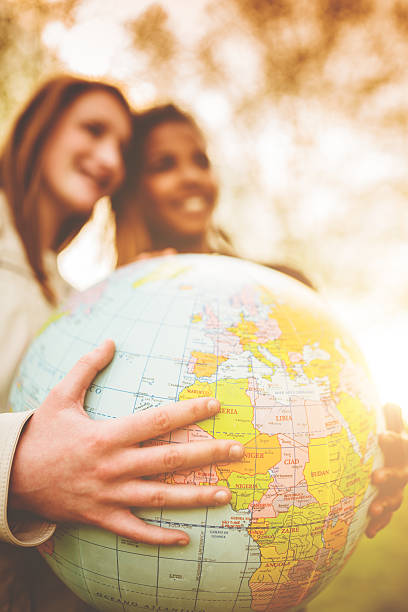 istock teenagers college student smiling with globe 485168285