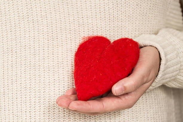istock Red Valentines Day Heart in Woman's Hand 485168531