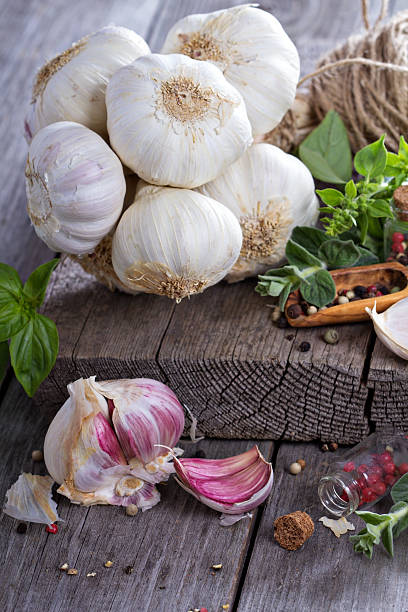 istock Garlic heads on a wooden table 485169325