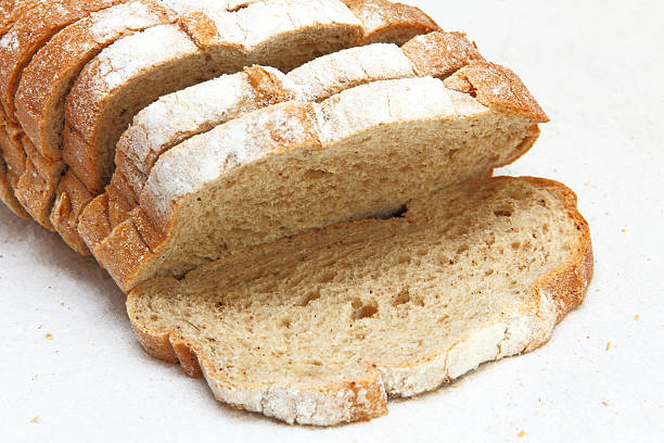 istock Fresh sliced bread taken closeup on white fabric. 485174648