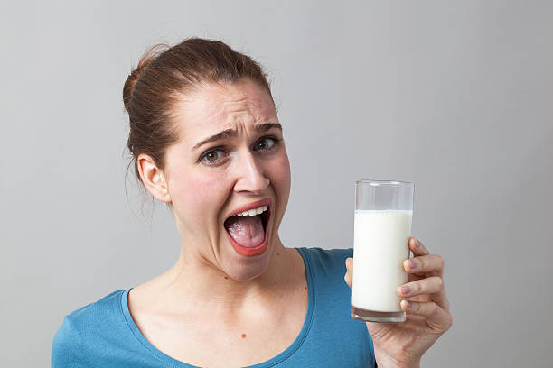 istock shouting girl disgusted at dieting white protein liquids 485178388