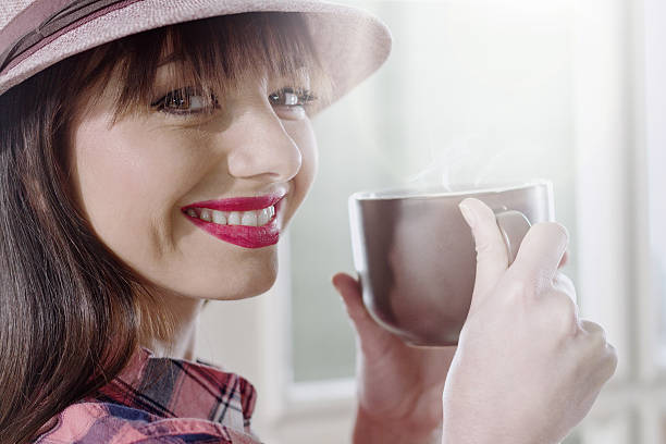 istock Young woman enjoying hot coffee 485179254