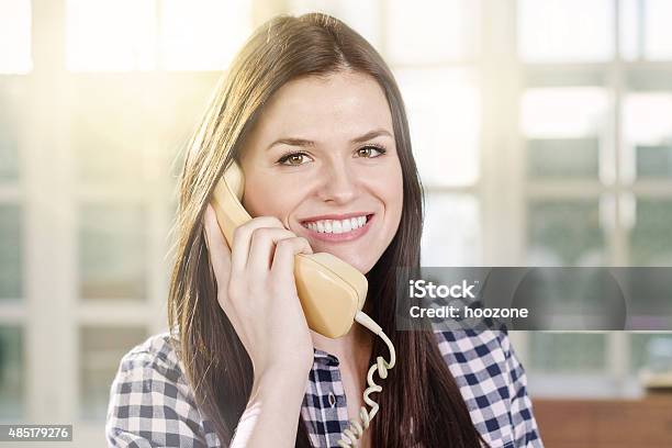 Young Woman Using Retro Phone Stock Photo - Download Image Now - 2015, Adult, Adults Only