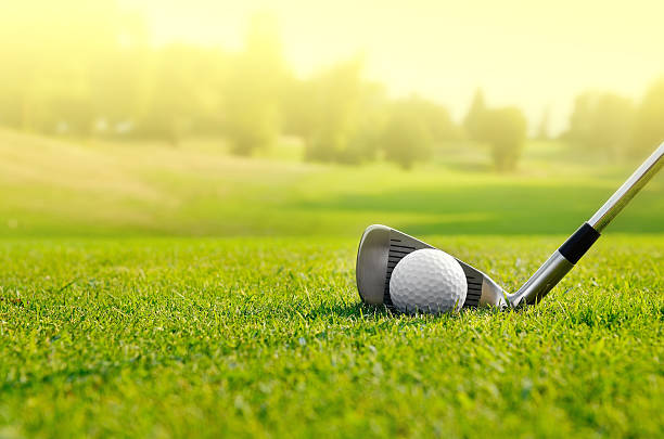 Let's golf Close up of a golf ball on the field sports ball photos stock pictures, royalty-free photos & images