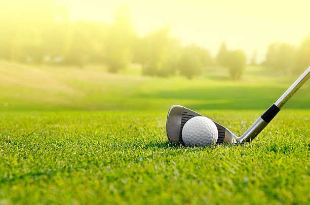 Let's golf Close up of a golf ball on the field Golf stock pictures, royalty-free photos & images