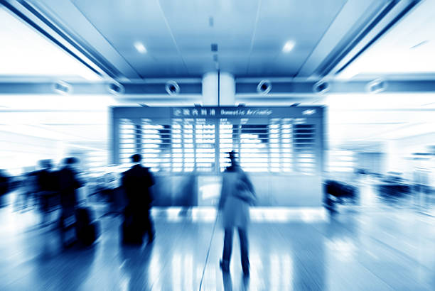 Passengers in Shanghai Pudong Airport; Motion Blur.