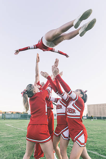 istock Group of Cheerleaders Performing Stunts 485191011
