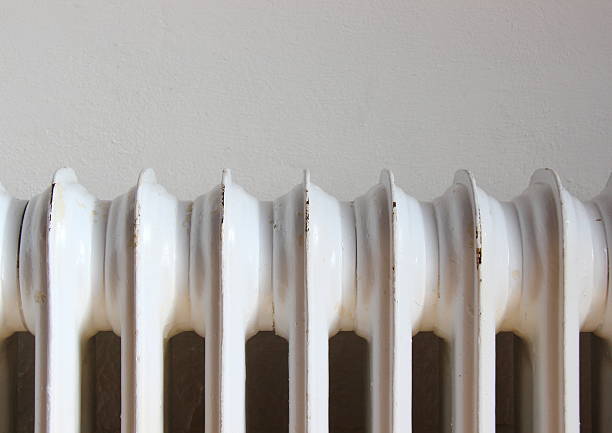 istock Closeup on worn radiator with white wall background 485191443