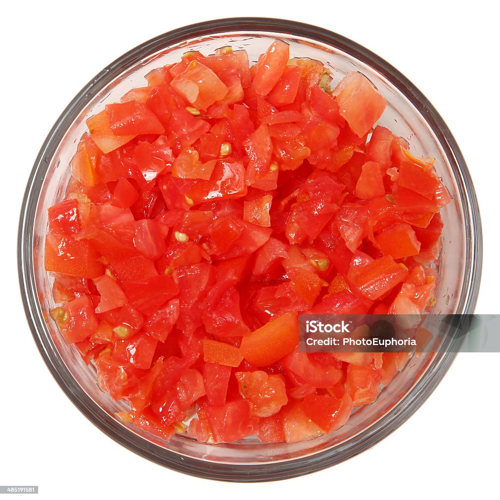 Glass Bowl of Diced Tomatoes with Top View Over White Glass Bowl of Diced Tomatoes with Top View Isolated Over White Tomato Stock Photo