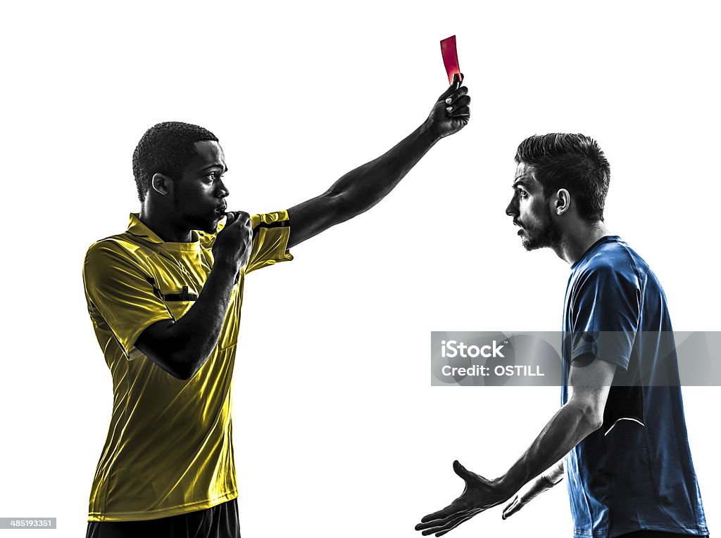 two men soccer players and referee showing red card silhouette two men soccer player and referee showing red card in silhouette on white background Referee Stock Photo