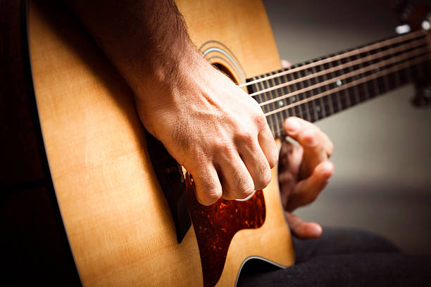 istock Male guitarist player with vignette 485193359