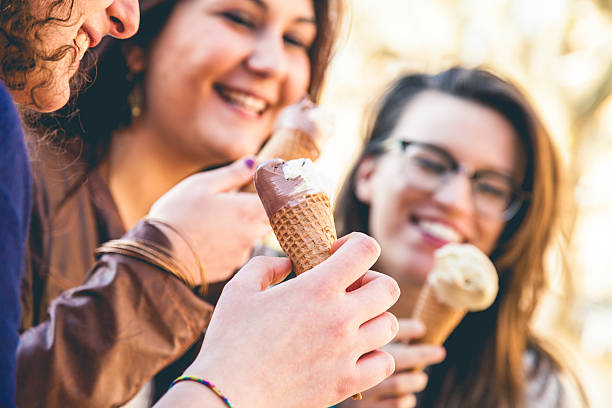 istock Three women eating an ice cream outdoor 485193745