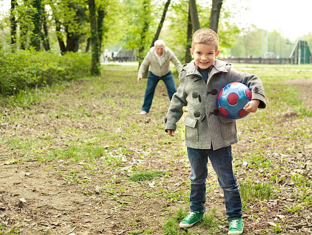 istock Grandfather and grandson enjoy a game 485193885