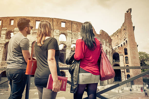 istock Tourists with a guide in front of the Coliseum, Rome 485193911