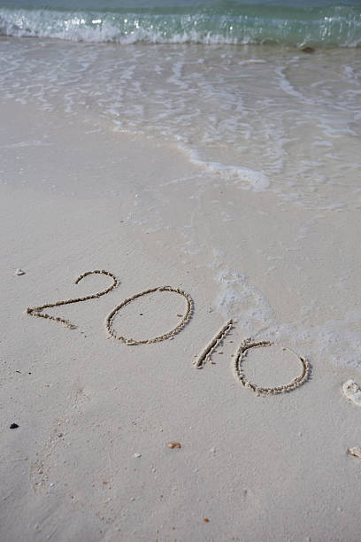 istock Numbers 2016 on beach - concept holiday background 485193922