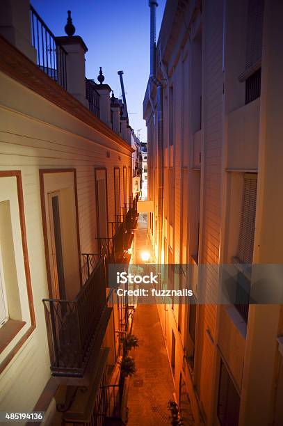 Dark Alley Seville Spain Stock Photo - Download Image Now - 2015, Alley, Lighting Equipment