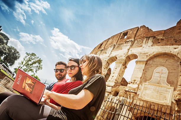 istock Tourists with a guide in front of the Coliseum, Rome 485194219