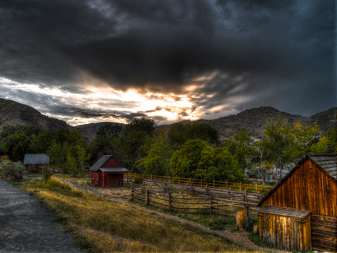 A rustic view of Golden, Colorado, with the sun setting behind the mountains.