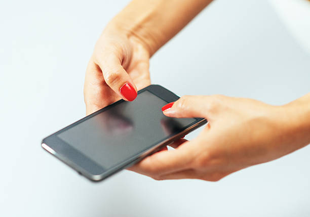 istock Caucasian woman using smartphone for social networking and communication 485201432