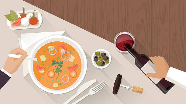 Fine dining at restaurant Fine dining at restaurant, a customer is eating a tasty soup and a waiter is pouring wine in a glass table illustrations stock illustrations