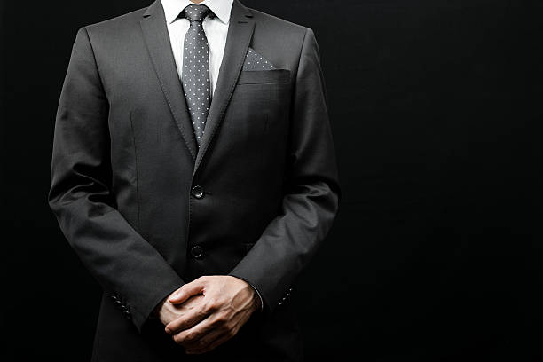 istock man in suit on a black background 485220322