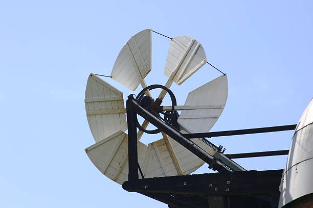 istock Fantail of windmill set against blue sky 485220424