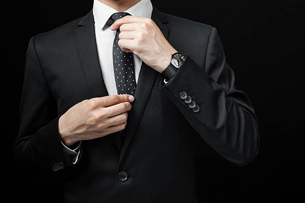 istock man in suit on a black background 485220484