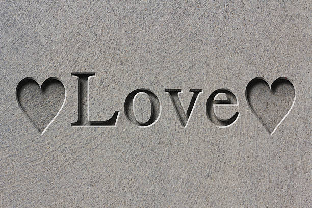mot amour gravé - eternity love stone heart shape photos et images de collection