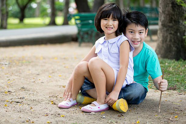 istock Little Asian child playing sand in the park 485231222