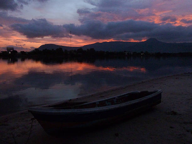 istock Dusky twilight and Boat along a Jungle River in Cambodia 485231458