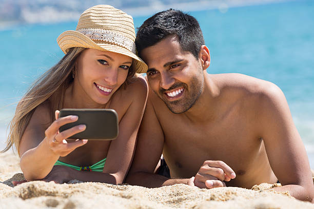 istock Smiling young couple taking photo 485231846