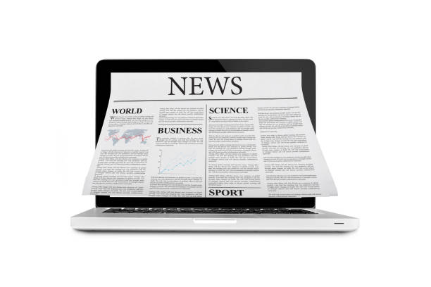istock Newspaper out of laptop 485232544