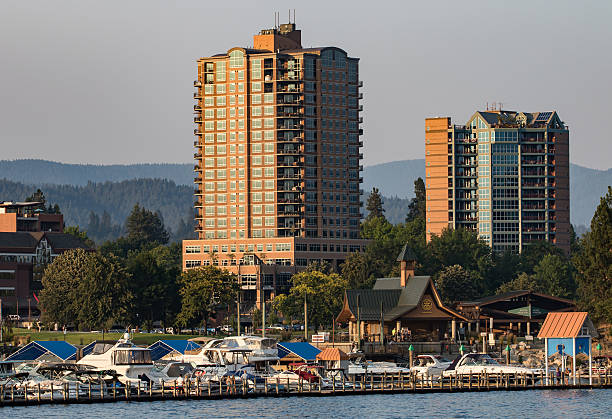 Heart of Alene Skyline Coeur d'Alene, Idaho, USA-July 9, 2015: A view of a large hotel and office buildings in Idaho from LakeCoeur d'Alene during sunset. triangular solar panels stock pictures, royalty-free photos & images