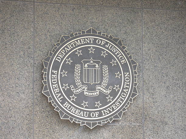 FBI emblem Washington, USA - August 11, 2009: FBI emblem on the J. Edgar Hoover F.B.I. Building in downtown Washington, DC. fbi photos stock pictures, royalty-free photos & images