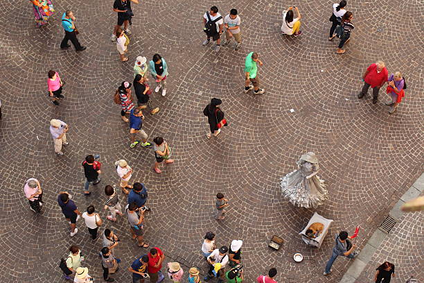Innsbruck, Austria - July 27, 2015: Aerial view of tourists in Old City (Altstadt or Altestadt) taken from the top of City Tower (Stadtturm, 51 meters) on Herzog-Friedrich Street.