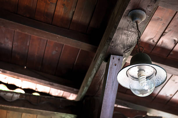 istock Vintage country lamp on wooden ceiling 485241456
