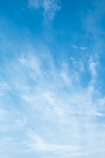 Blue sky with delicate arabesques of  cirrus clouds