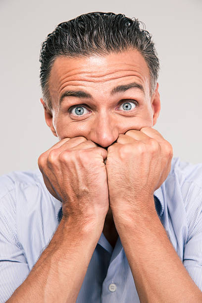 istock Portrait of a frightened man looking at camera 485246764