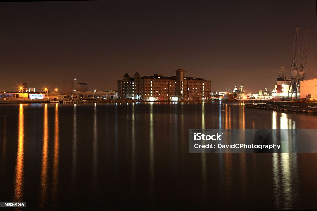 Birkenhead Dock Beauty The dock water reflections cast long shadows on a calm evening The Wirral Stock Photo