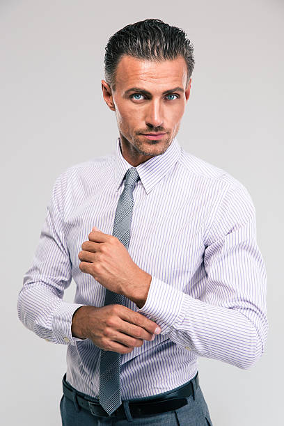 istock Businessman buttoning cuff sleeves 485249590