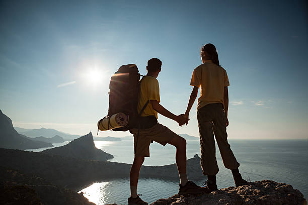 istock Couple looking at beautiful sunrise 485249914
