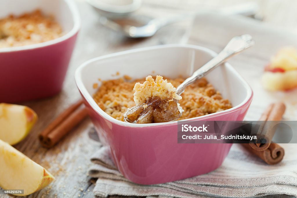 Apple crumble with cinnamon Apple crumble with cinnamon on rustic wooden table 2015 Stock Photo