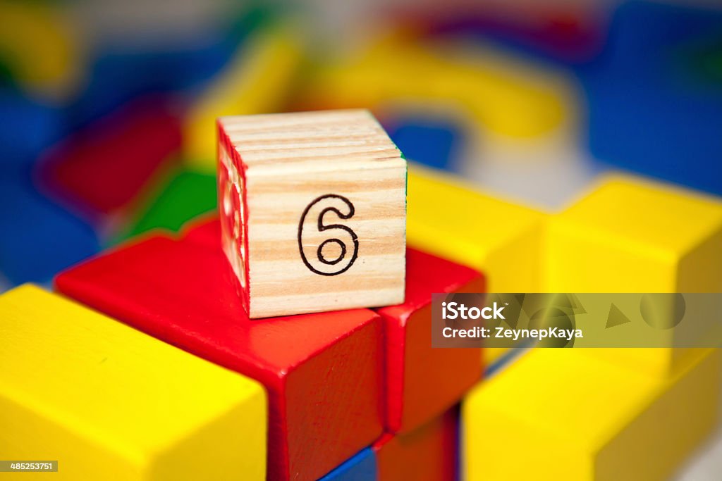 Wooden cube with number 6. Wooden blocks with numbers. Close-up Stock Photo