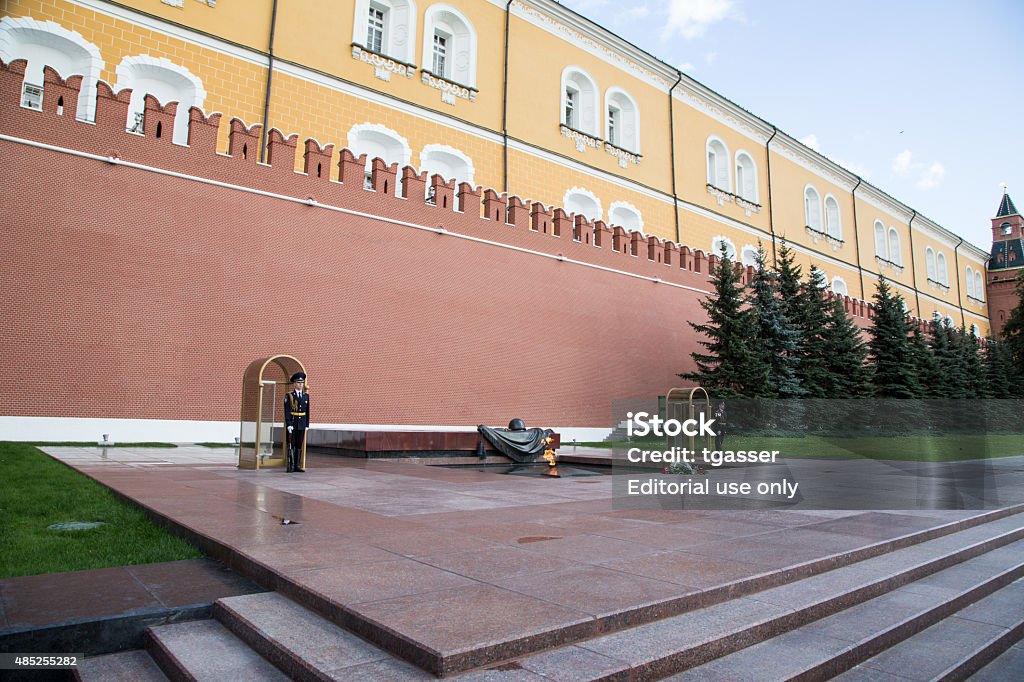 Eternal Fire and tomb of Unknown Soldier Moscow, Russia - August 1, 2015: Honor Guard Standing near Eternal Fire and the tomb of Unknown Soldier under the wall of Moscow Kremlin, Russia 2015 Stock Photo