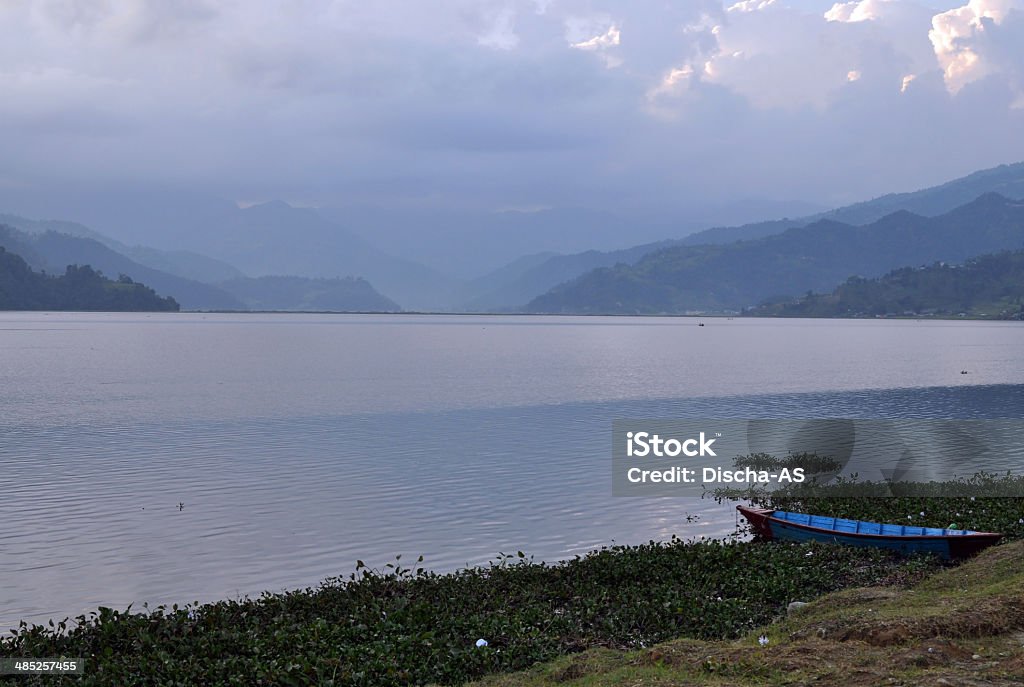 lake Lonely boat floating on the lake. Beauty Stock Photo
