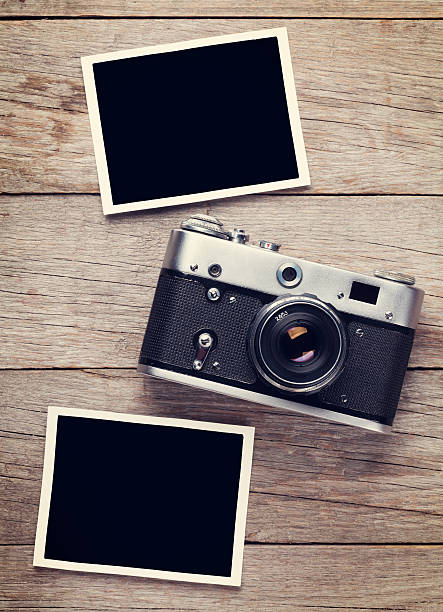 istock Vintage film camera and two blank photo frames 485257720