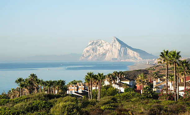 Landscape with the rock of Gibraltar in the background. Alcaidesa urbanization in the foreground. Panorama of Straits of Gibraltar. Summer day morning. British overseas territory. Mediterranean sea.  gibraltar photos stock pictures, royalty-free photos & images